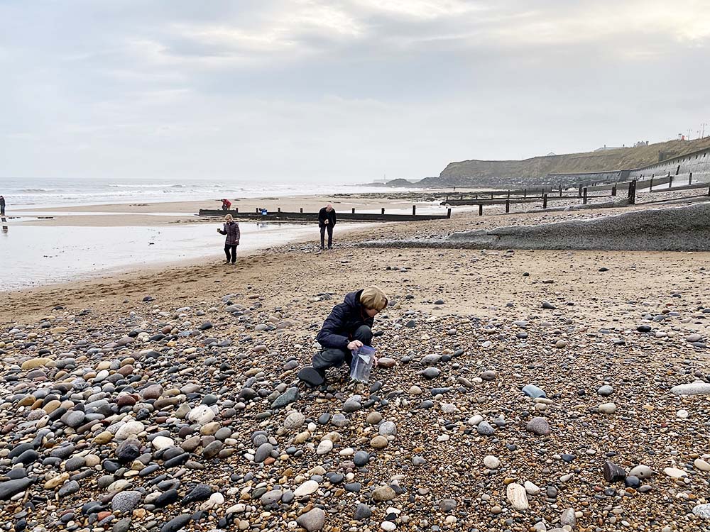 Searching for sea glass on the English coast.